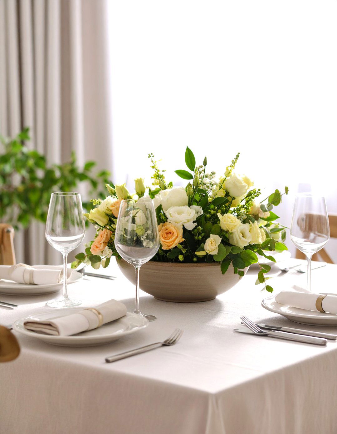 Asymmetrical Floral Arrangement Energizes the Dining Table - 20 Dining Room Table Decor Ideas