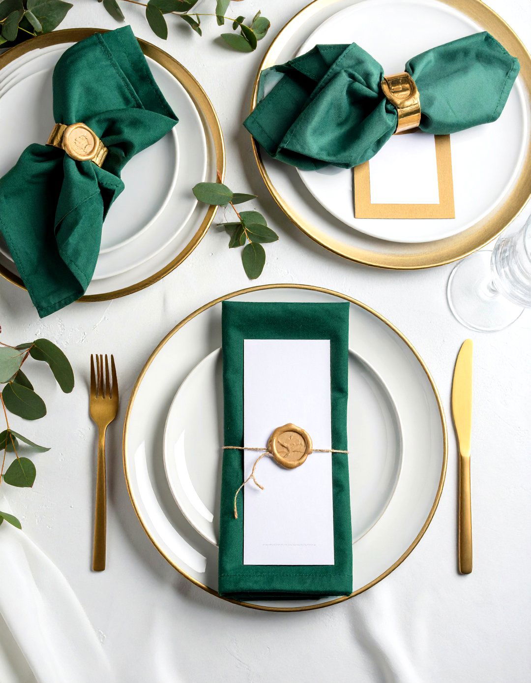 Gold Trimmed Chargers and Emerald Napkins Elevate Place Settings - 20 Emerald Green Wedding Ideas