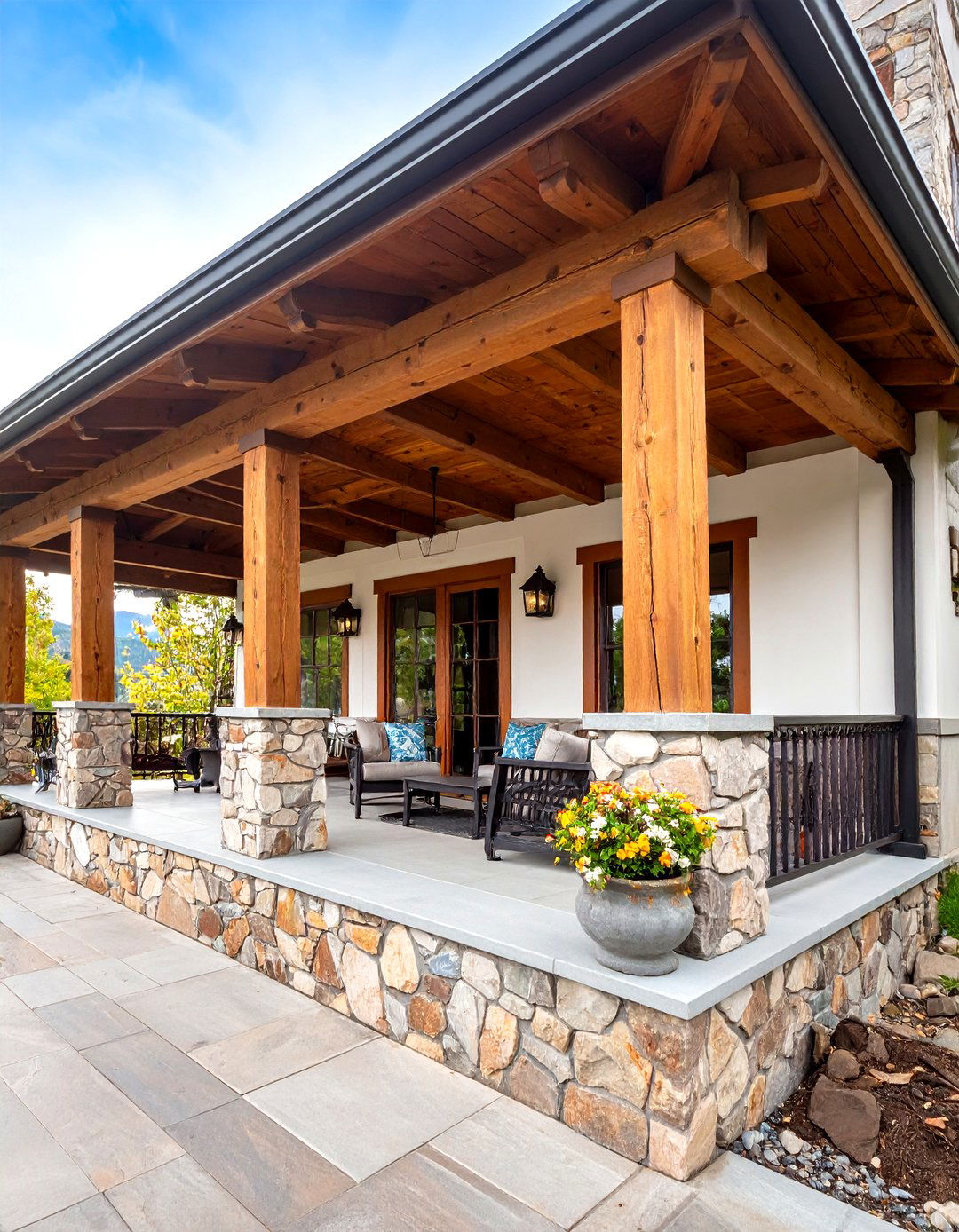 Mountain Lodge Rustic Porch with Stone Columns - 20 Rustic Porch Ideas