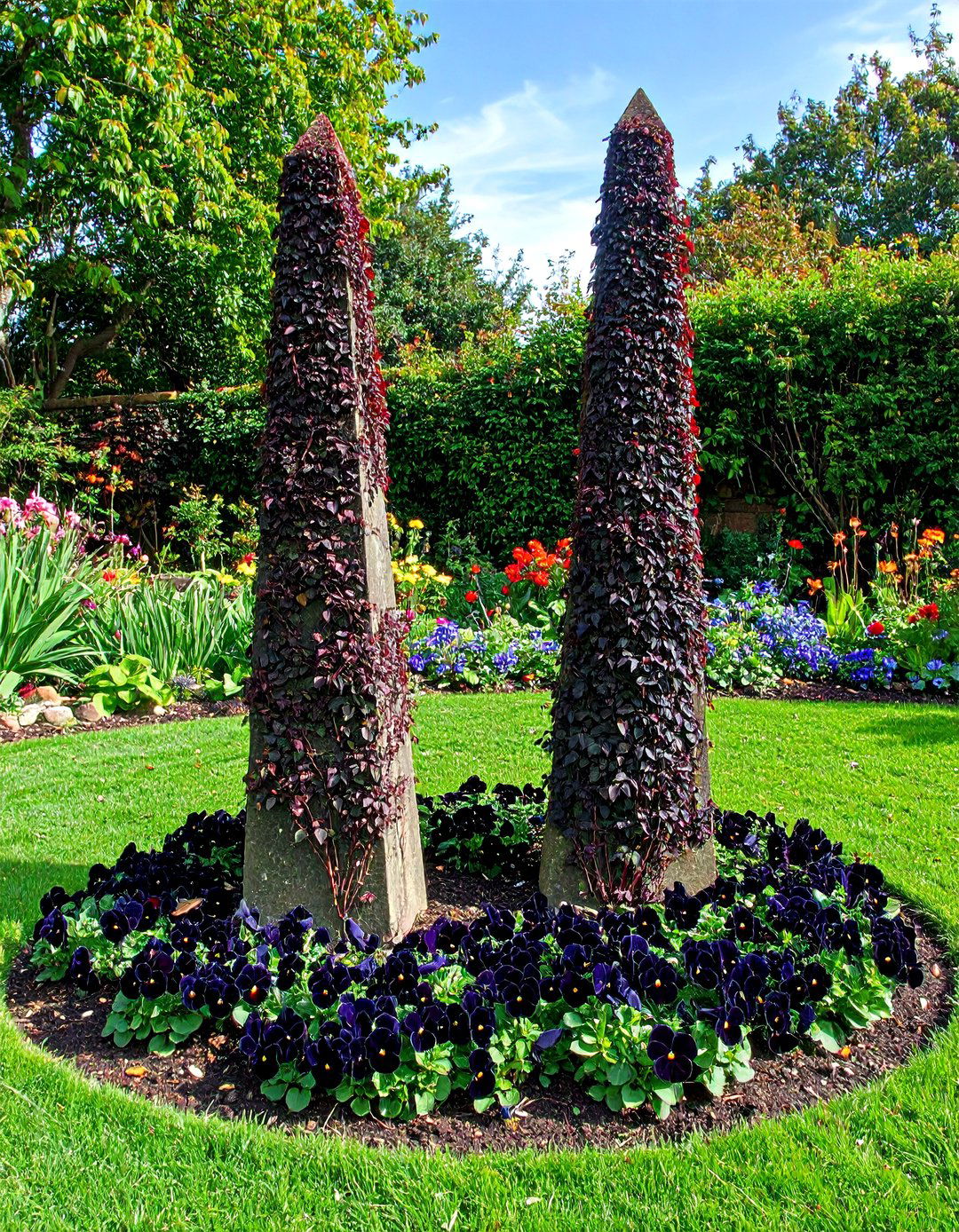 Obelisks Dressed in Dark Climbers Add Height - 20 Gothic Garden Ideas