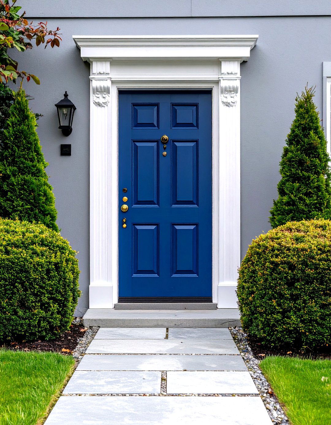 Royal Blue Door with Ornate White Trim on Grey House - 20 Grey House With Blue Door Ideas