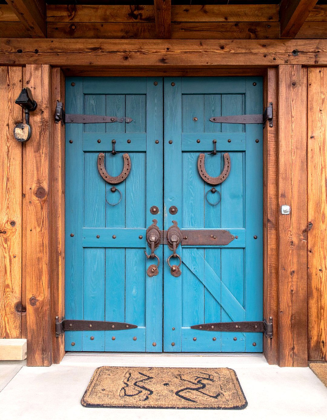 Rustic Plank Front Door with Horseshoe Accents - 20 Rustic Front Door Ideas