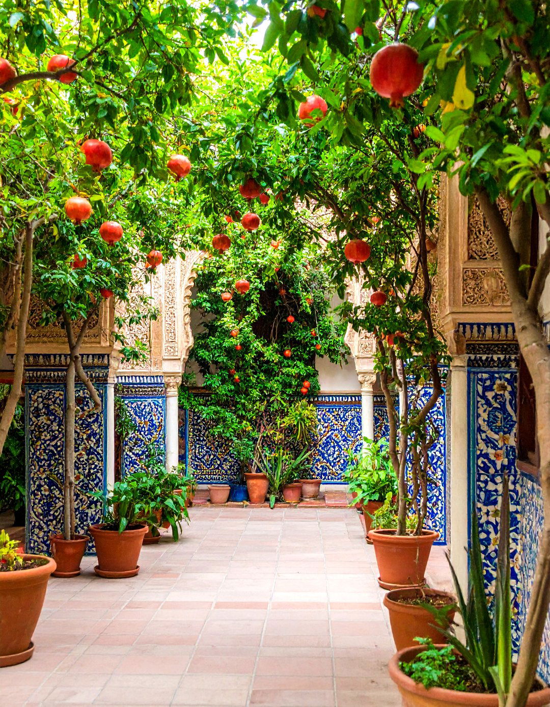 Spanish Style Patio Showcasing Andalusian Ceramic Wall Art - 20 spanish style patio ideas