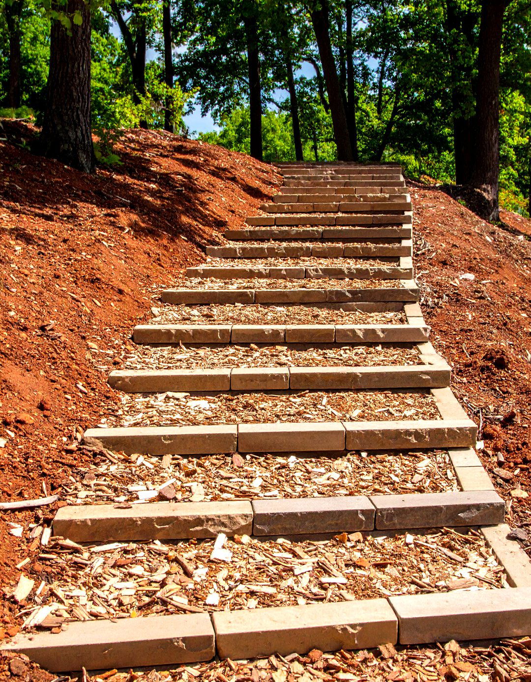 Tiered Rock Terraces on a Sloped Front Yard - 20 Front Yard Landscaping Ideas With Rocks and Mulch