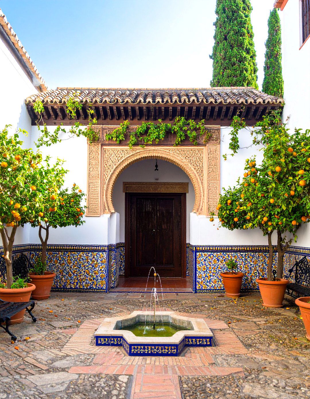 Traditional Andalusian Spanish Courtyard with Central Fountain - 20 Spanish Courtyard Ideas